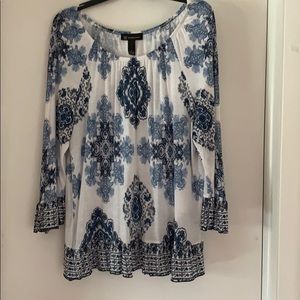 Long sleeve blue and white blouse.